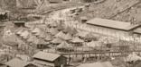 A view of daily life in the barracks, tents and barbed wire enclosure at Honouliuli Internment Camp. c. 1945