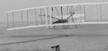 The iconic first flight of the Wright brothers in their 1903 Wright Flyer